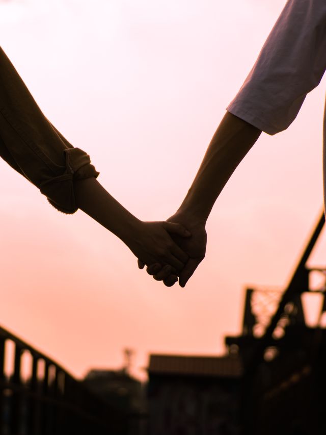 a couple holding hands