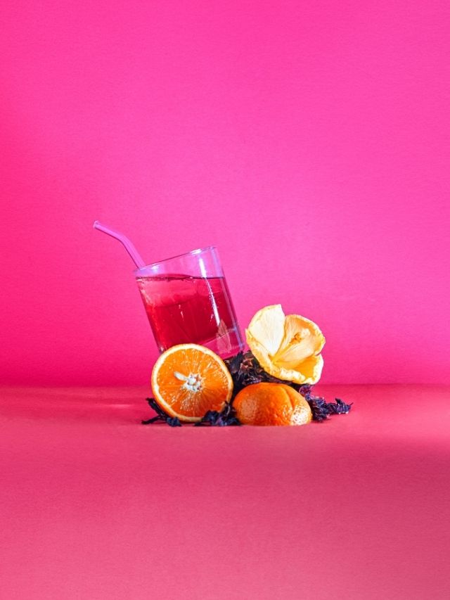 pink and orange fruits on pink background