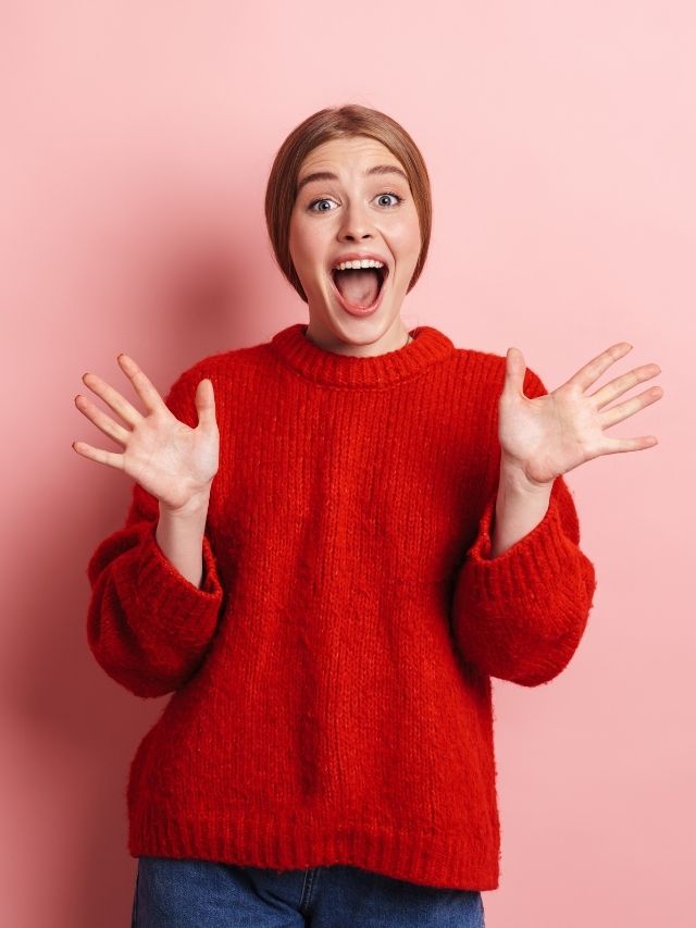 girl with excitement on a pink background