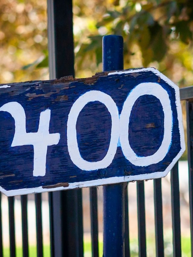 400 number written on a blue wooden sign
