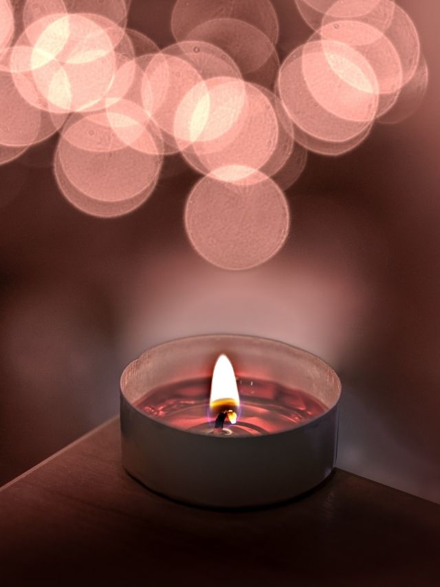 a candle lit on a table
