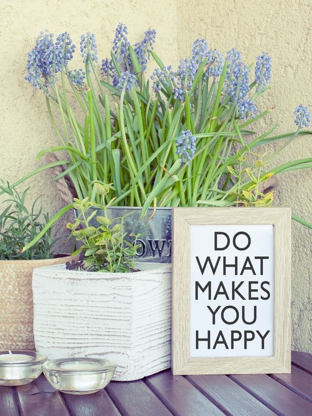 do what makes you happy sign with flowers