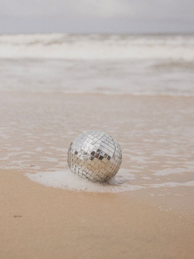disco ball on beach