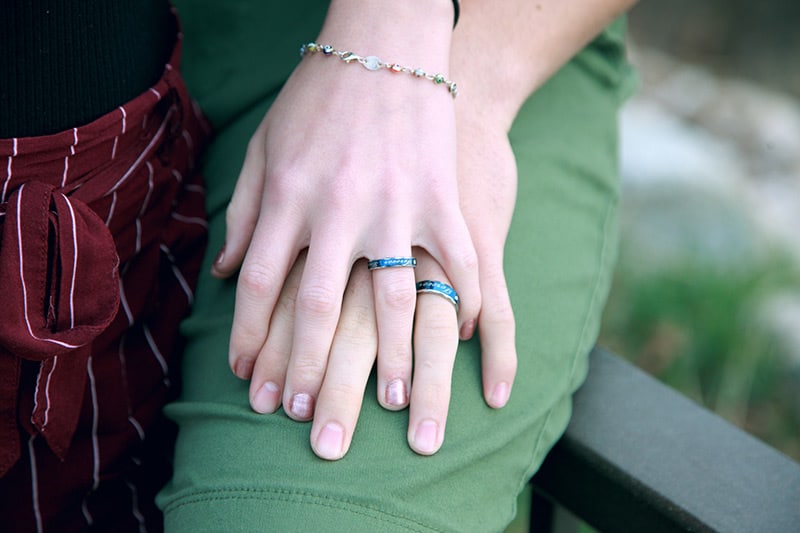 Couple's hands wearing matching rings