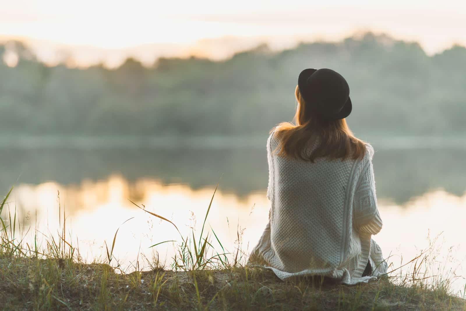 an imaginary woman sitting by the river