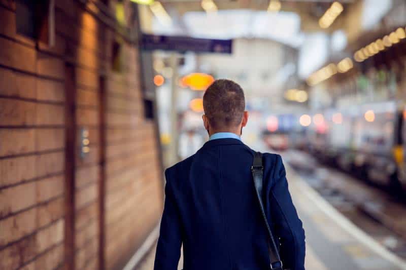 business man in suit walking at the station