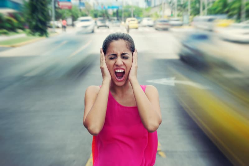 woman with panic attack in the middle of street