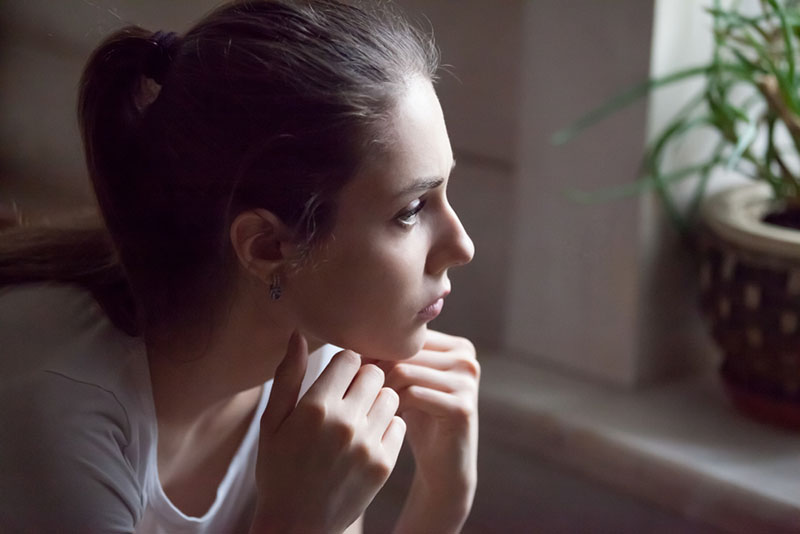 sad woman sitting in the dark